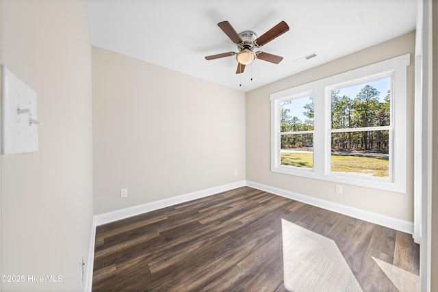 1191 Pierce Rd, Southport, NC 28461 - spare room featuring dark wood finished floors, visible vents, baseboards, and a ceiling fan