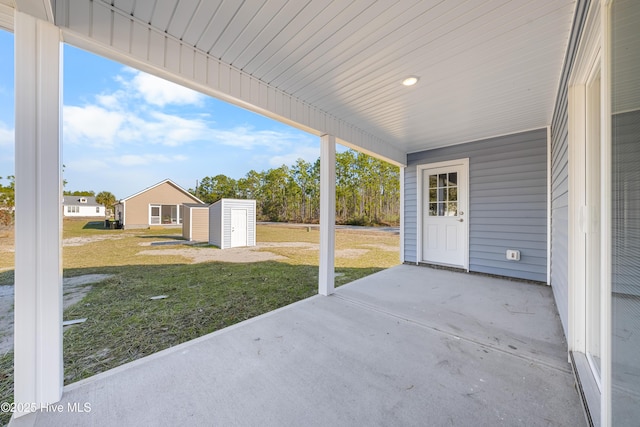 1191 Pierce Rd, Southport, NC 28461 - view of patio / terrace with an outdoor structure and a storage unit