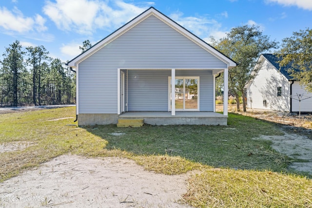 1191 Pierce Rd, Southport, NC 28461 - rear view of property with a porch and a lawn