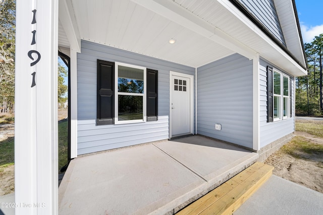 1191 Pierce Rd, Southport, NC 28461 - doorway to property with a patio area