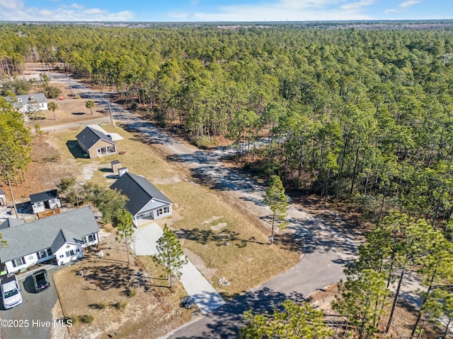1191 Pierce Rd, Southport, NC 28461 - birds eye view of property featuring a wooded view