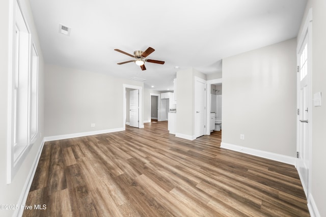 1191 Pierce Rd, Southport, NC 28461 - unfurnished living room with visible vents, wood finished floors, baseboards, and ceiling fan