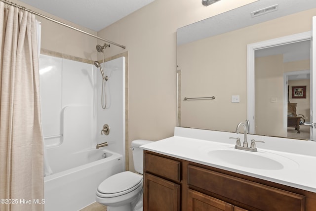 full bath featuring toilet, vanity, and shower / bath combo with shower curtain