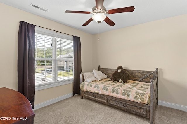bedroom with baseboards, multiple windows, and carpet flooring