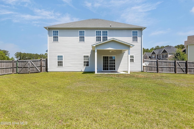 rear view of property featuring a patio and a gate