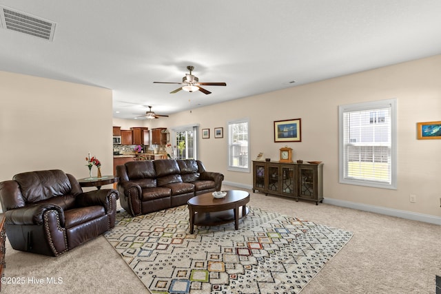 324 Catamaran Rd, Swansboro, NC 28584 - living area featuring light carpet, a ceiling fan, and baseboards
