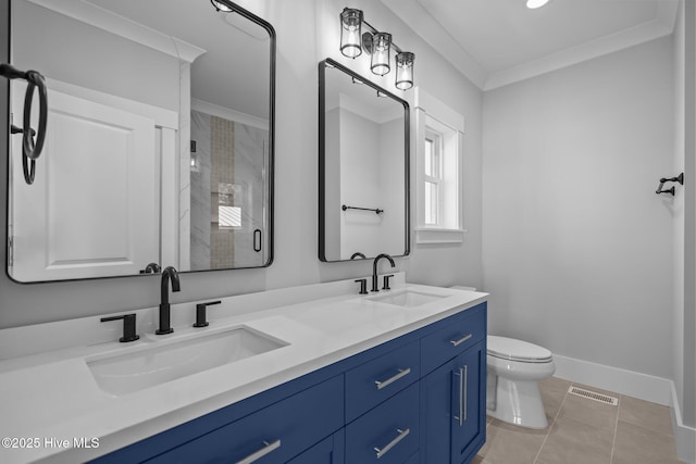 bathroom featuring a shower stall, toilet, visible vents, and a sink