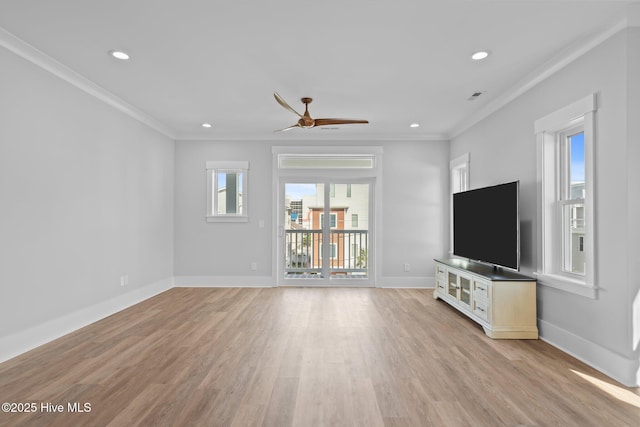 unfurnished living room with crown molding, light wood-style floors, baseboards, and ceiling fan