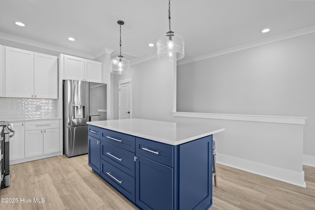 kitchen with light wood-style floors, crown molding, stainless steel refrigerator with ice dispenser, and blue cabinetry