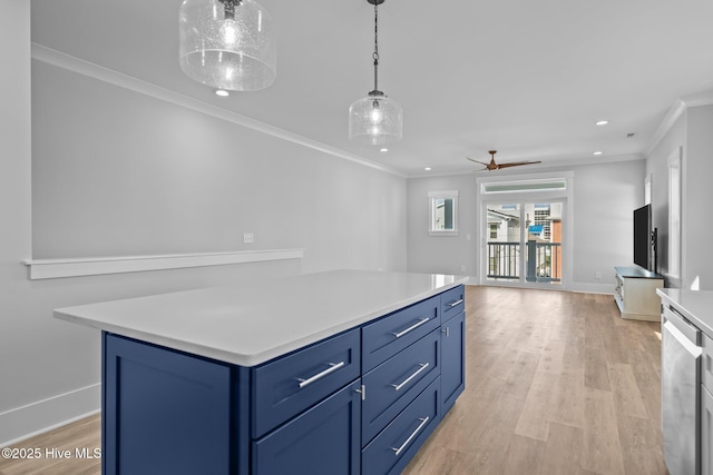 kitchen featuring recessed lighting, light countertops, crown molding, and blue cabinetry