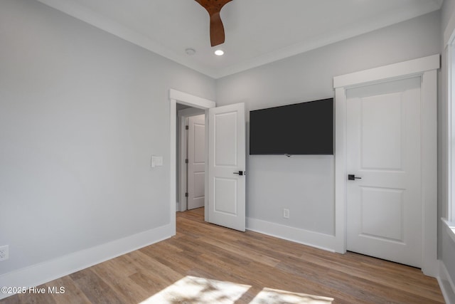 unfurnished bedroom featuring a ceiling fan, wood finished floors, baseboards, and recessed lighting