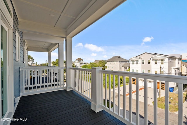 wooden terrace with a residential view