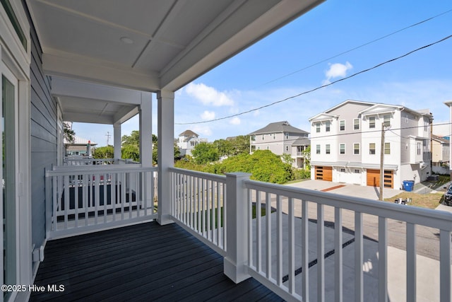 wooden terrace with a residential view