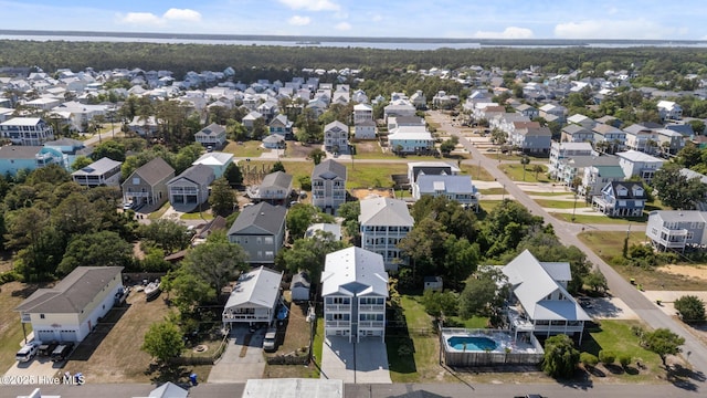 birds eye view of property with a residential view