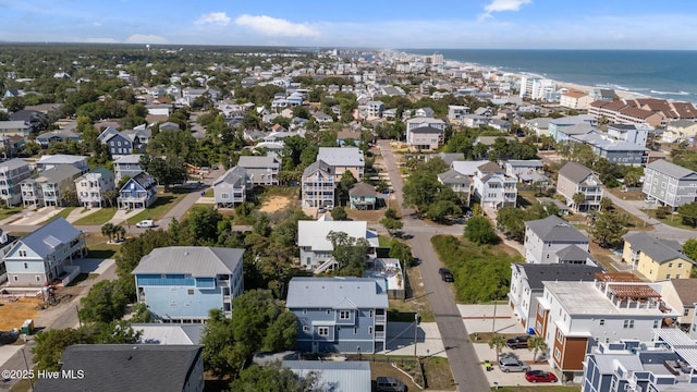birds eye view of property with a water view and a residential view
