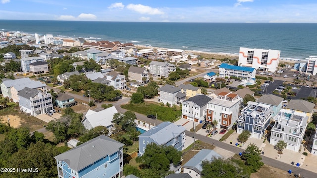 birds eye view of property featuring a water view and a residential view