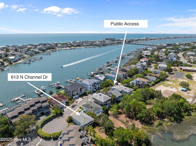 aerial perspective of suburban area with a large body of water