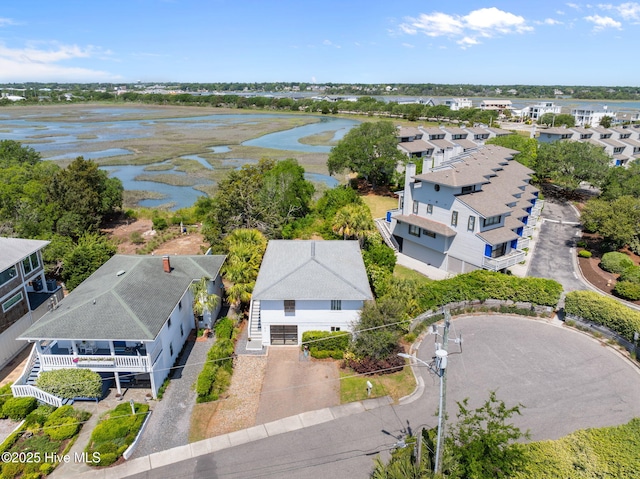 aerial perspective of suburban area with a large body of water