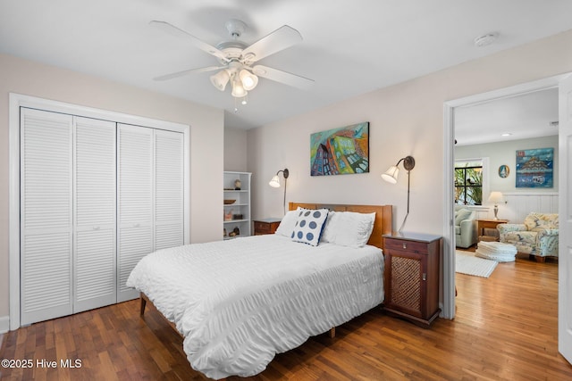 bedroom featuring wood finished floors, a closet, and a ceiling fan