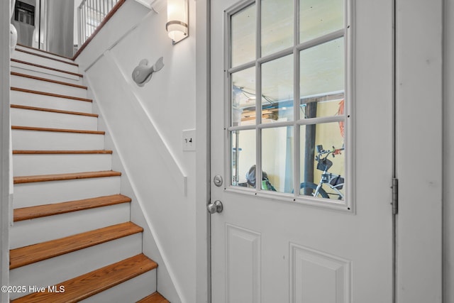 entryway featuring stairway and healthy amount of natural light