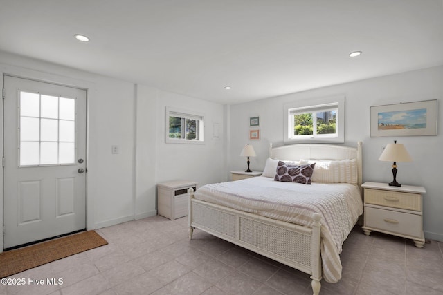 bedroom featuring recessed lighting, light tile patterned floors, and baseboards
