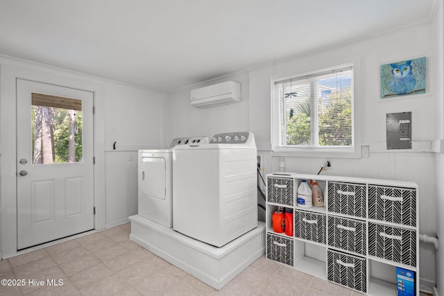 washroom with washer and dryer, healthy amount of natural light, and a wall mounted air conditioner