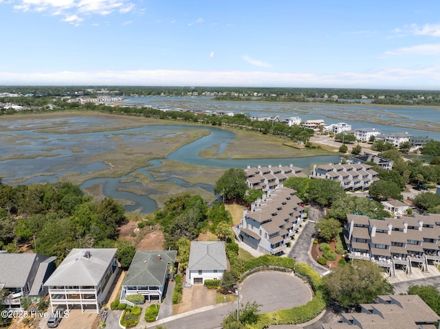 aerial view of property and surrounding area with nearby suburban area and a nearby body of water