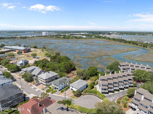 aerial perspective of suburban area featuring a nearby body of water