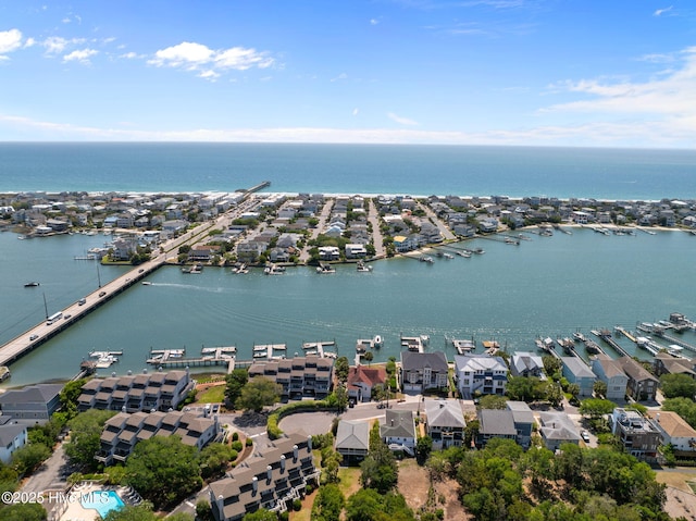 aerial perspective of suburban area with a large body of water