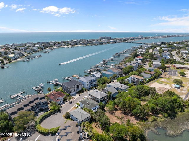aerial view of residential area with a nearby body of water