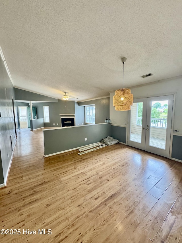 607 Spring Forest Rd Unit G, Greenville, NC 27834 - interior space with french doors, wood finished floors, a textured ceiling, visible vents, and a wealth of natural light