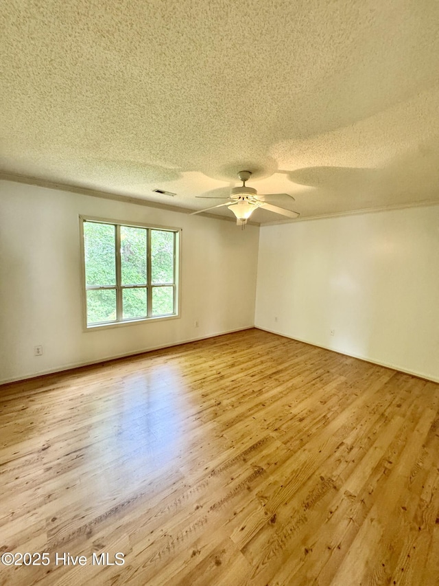 607 Spring Forest Rd Unit G, Greenville, NC 27834 - empty room featuring ceiling fan, light wood-style floors, visible vents, and a textured ceiling
