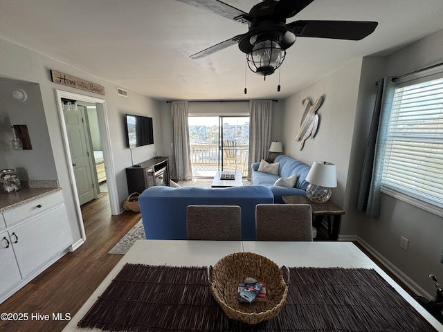 bedroom with dark wood-style floors, access to outside, a ceiling fan, and baseboards