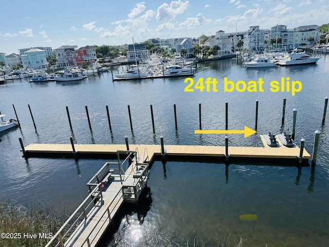 dock area with a water view and view of marina