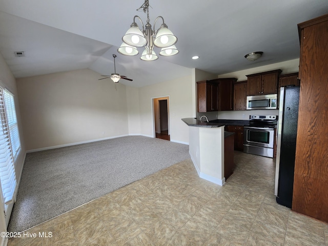 108 Hill Farm Dr, Richlands, NC 28574 - kitchen with appliances with stainless steel finishes, dark countertops, a chandelier, vaulted ceiling, and baseboards