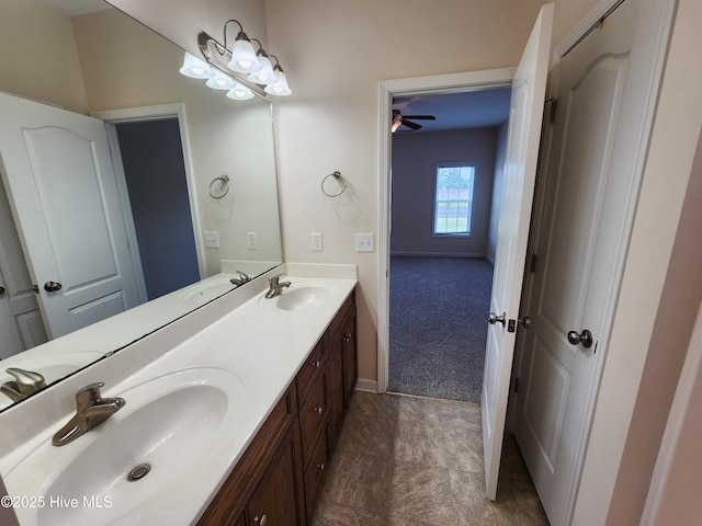 108 Hill Farm Dr, Richlands, NC 28574 - bathroom with double vanity, baseboards, and a ceiling fan
