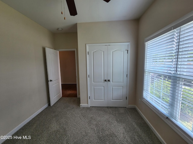108 Hill Farm Dr, Richlands, NC 28574 - unfurnished bedroom with carpet floors, baseboards, a closet, and ceiling fan