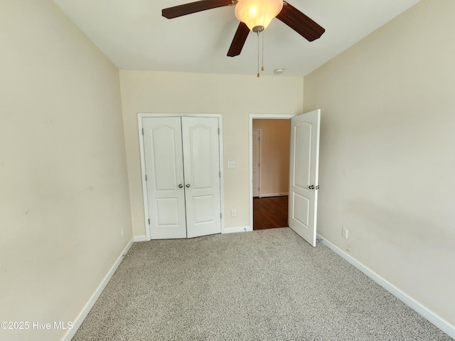 108 Hill Farm Dr, Richlands, NC 28574 - unfurnished bedroom with carpet flooring, a closet, baseboards, and ceiling fan