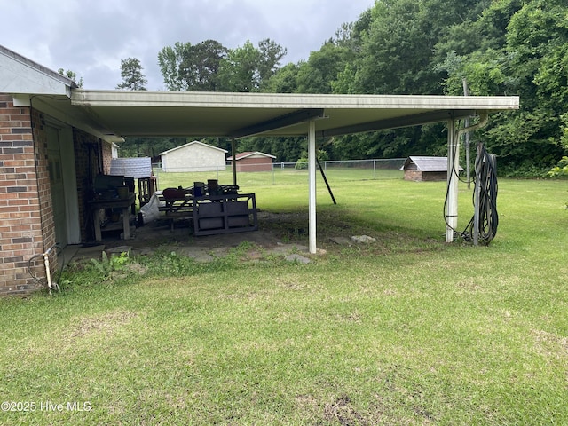 view of yard with an attached carport