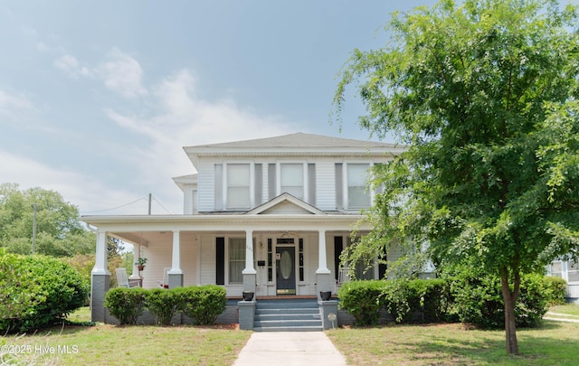 203 Minturn Ave, Hamlet, NC 28345 - view of front of house with covered porch and a front yard
