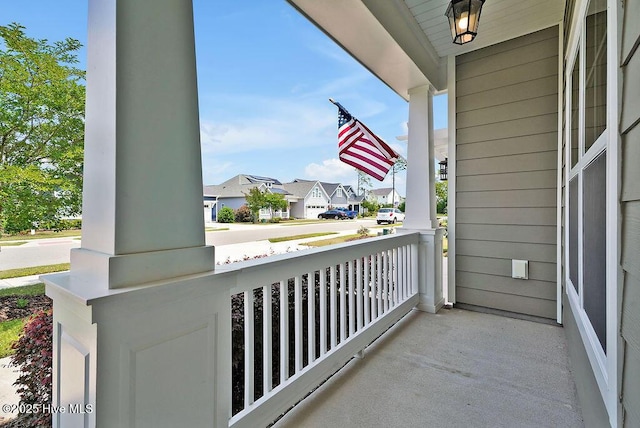 balcony featuring a porch and a residential view