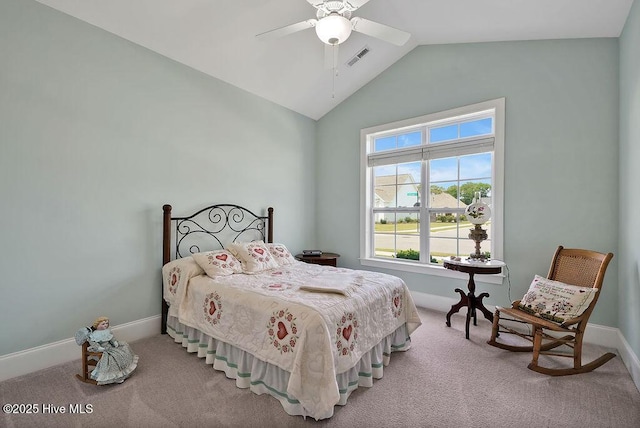 bedroom with vaulted ceiling, carpet floors, baseboards, and a ceiling fan