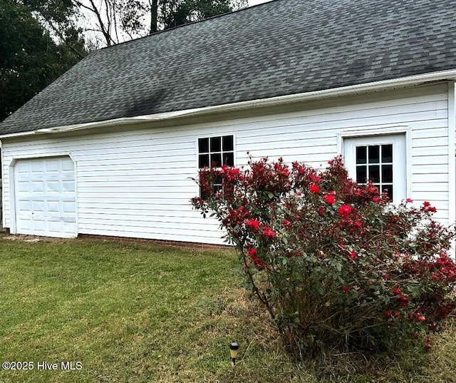 1120 Princeton Kenly Rd, Kenly, NC 27542 - view of property exterior featuring roof with shingles and a yard