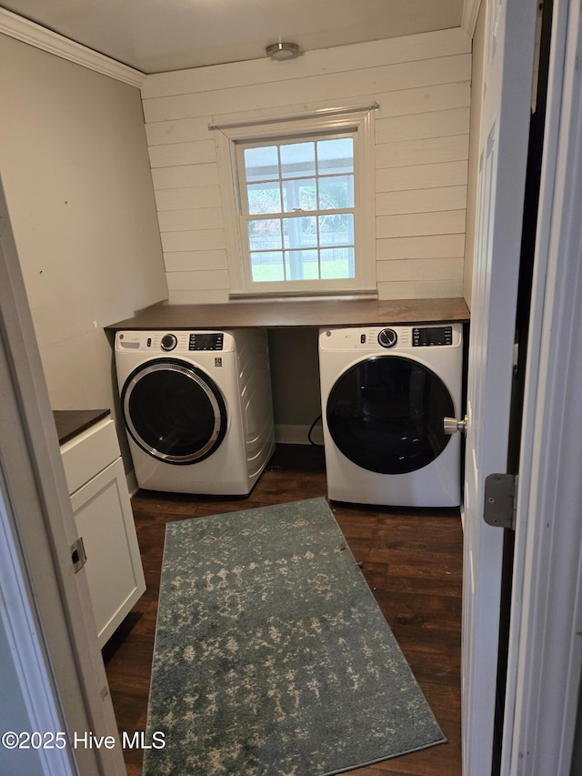 1120 Princeton Kenly Rd, Kenly, NC 27542 - washroom featuring dark wood finished floors, cabinet space, washing machine and dryer, crown molding, and wooden walls