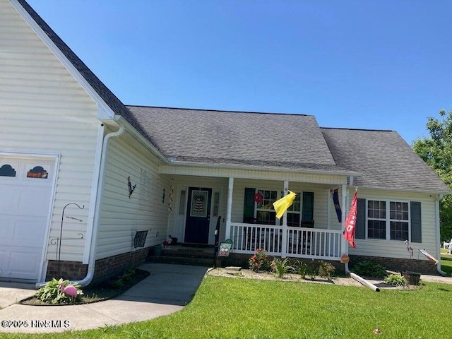 2902 Brems Battery, New Bern, NC 28562 - view of front of home with covered porch, a garage, a front lawn, and roof with shingles