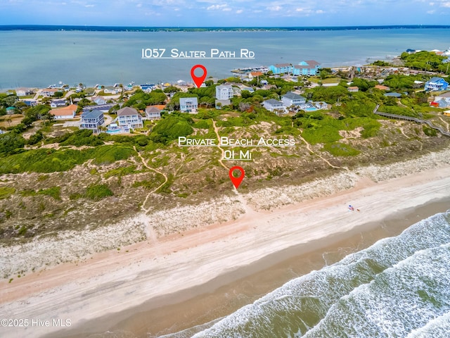 aerial perspective of suburban area featuring expansive beach