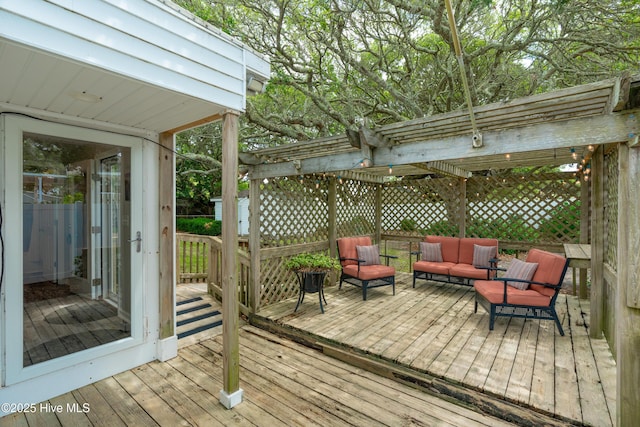 deck featuring a pergola and an outdoor living space