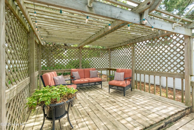 wooden terrace featuring a pergola and outdoor lounge area