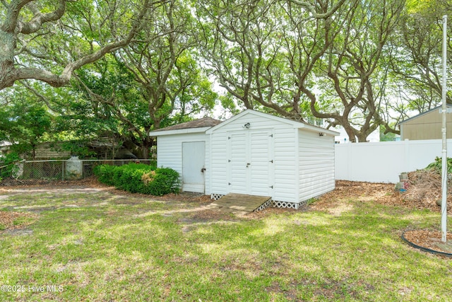 garage featuring a storage unit