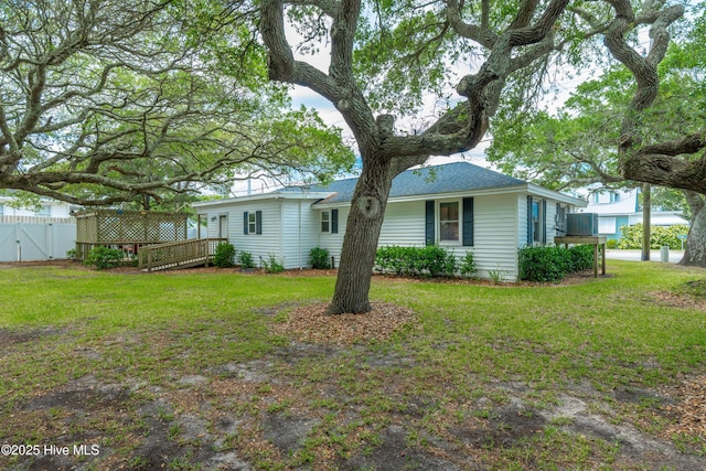 rear view of house with a wooden deck